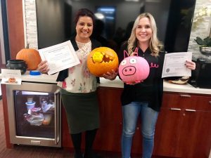 Alta Construction team members hold a pumpkin carving contest 