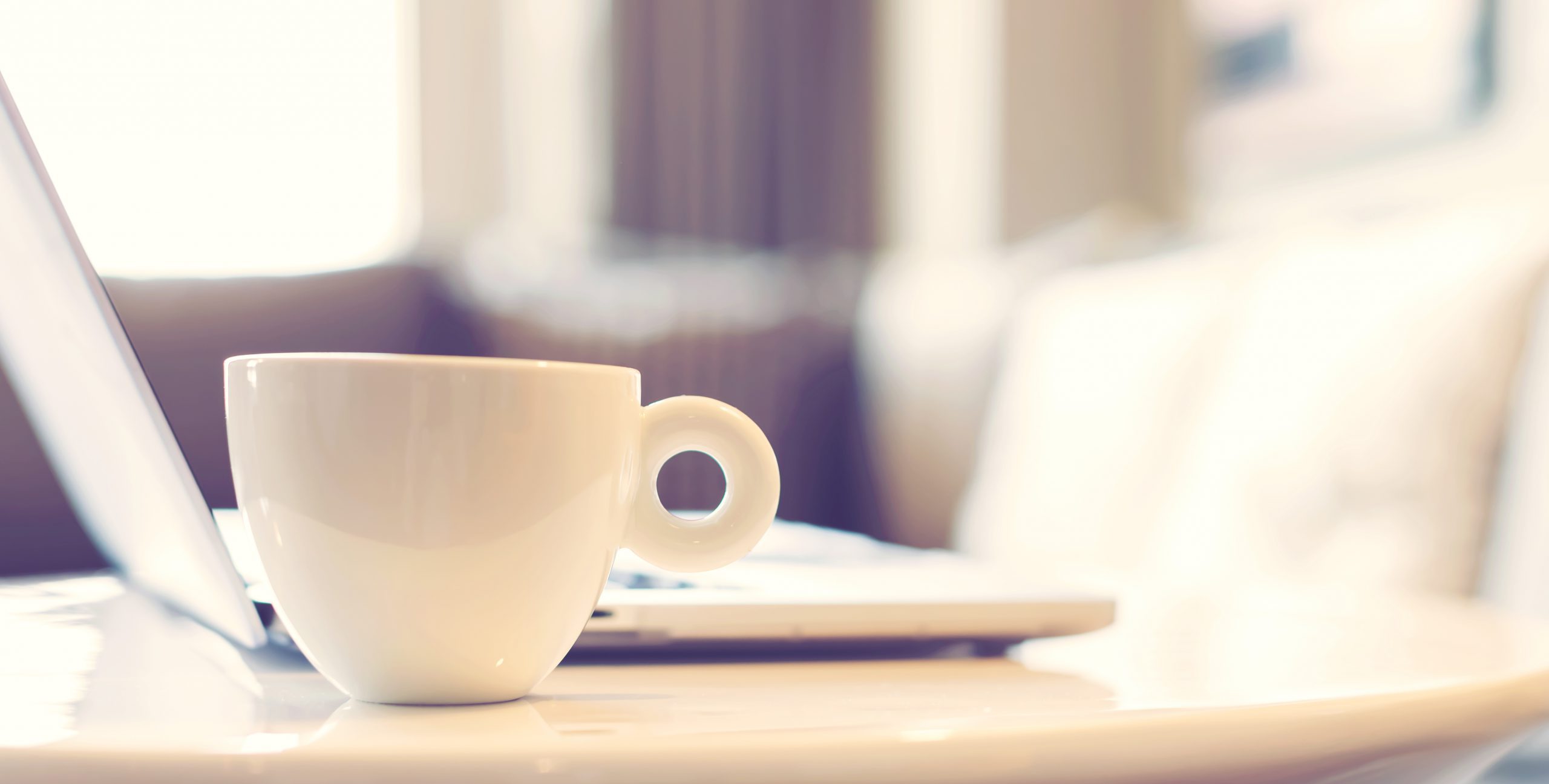 white coffee mug with a laptop